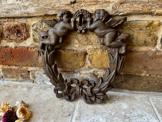large antique french cast iron wall plaque putti cherubs trumpets bows wreath vintage wedding gift